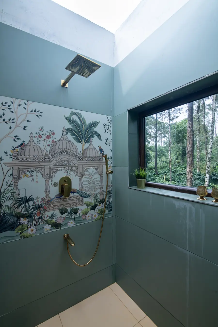 Outdoor shower open to the sky, with a hand-painted mural on the wall
