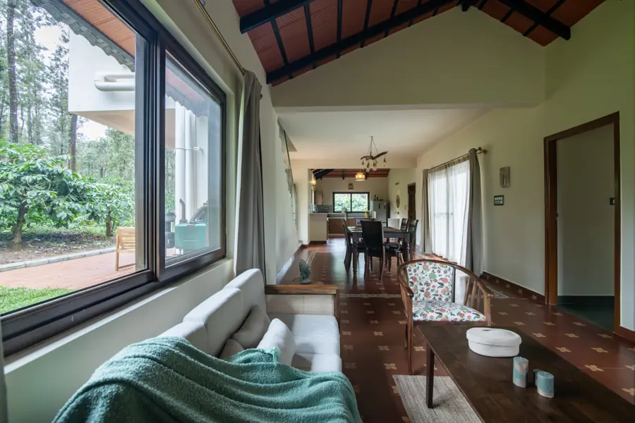 A long view through the house from a window seat to the dining room
